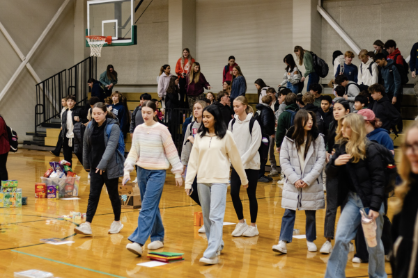 After hearing this quarter's announcements, students split off into groups to deliver supplies to teachers.